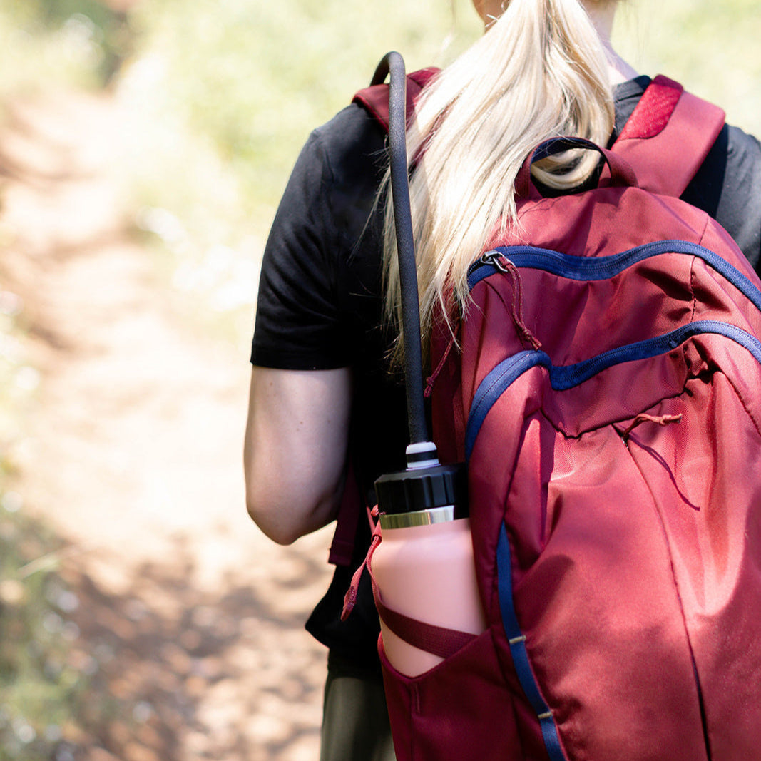 Backpack water bottle with tube clearance